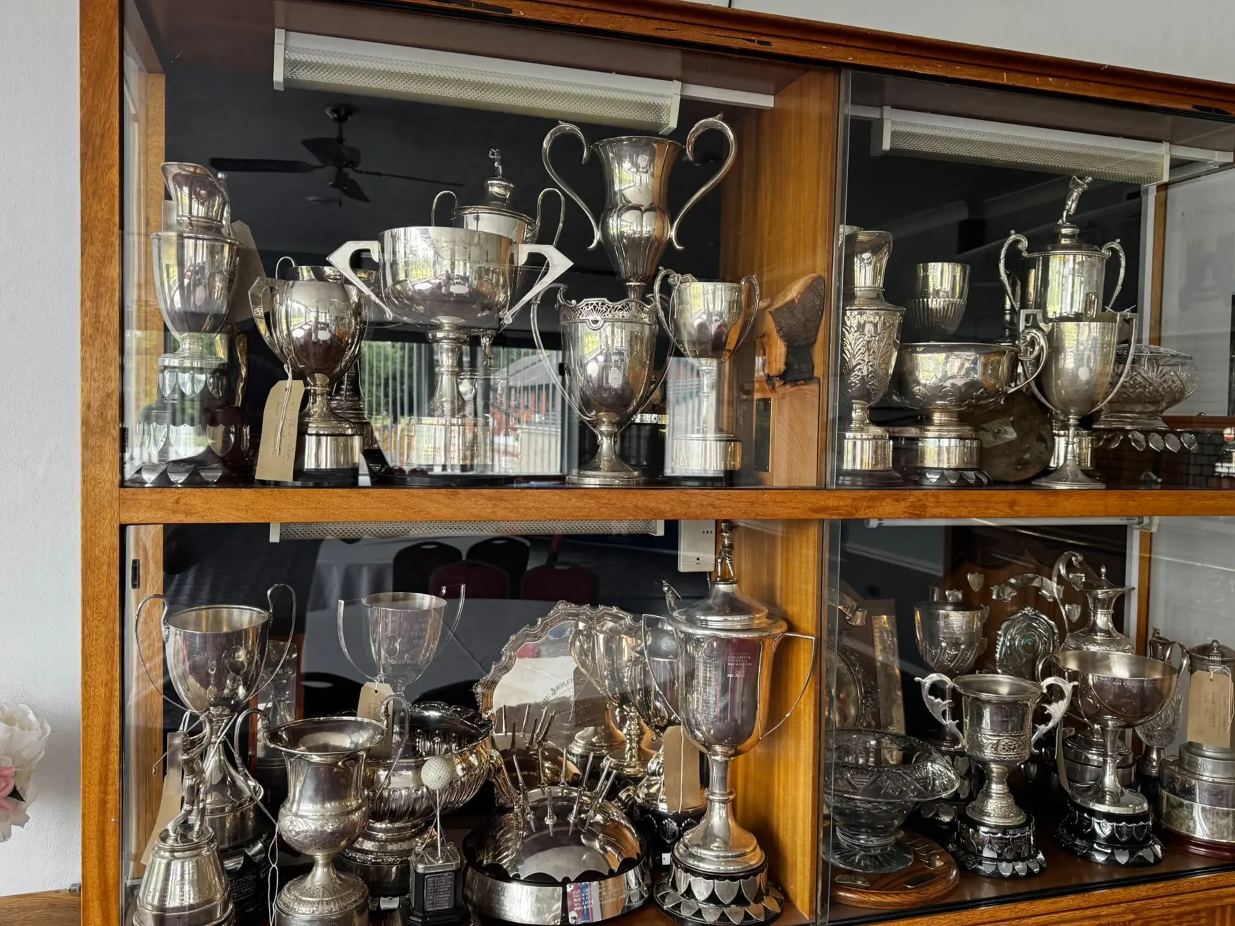 Dudley Golf Club trophy and heritage collection displayed in the clubhouse cabinet